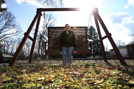 Image: In this Monday, Jan. 30, 2017, photo, Ashley Grant sits on a swing near her home in Bridgeton, New Jersey.