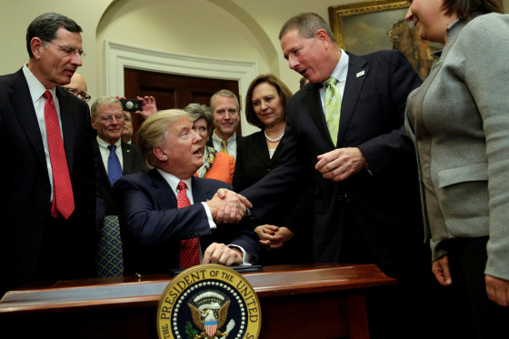 Image: U.S. President Donald Trump greets guests after signing the water executive order at the White House, in Washington