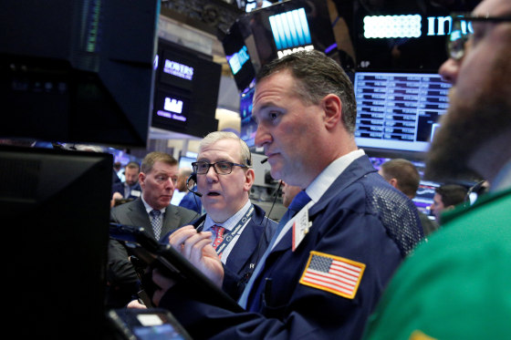 Image: Traders work on the floor of the NYSE