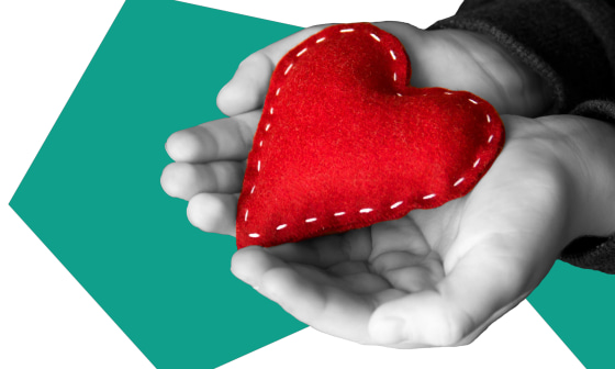 Image: Illustration of two hands holding a plush heart by NBC Photo Illustration