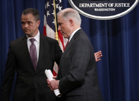 Image: Sessions departs following a press conference at the Department of Justice