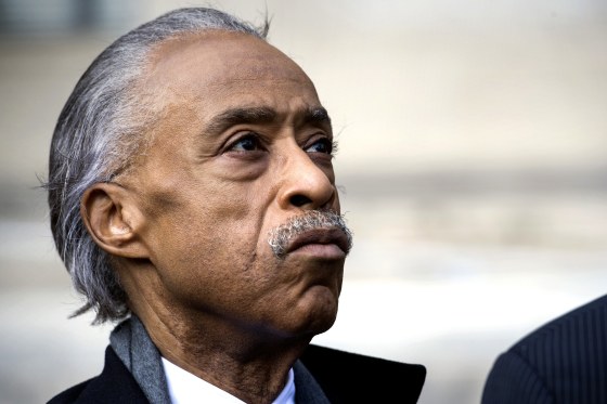 Image: Rev. Al Sharpton, founder of National Action Network, looks up while speaking with the news media