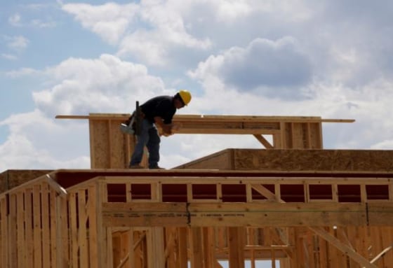 Workers construct a new home in Leyden Rock in Arvada, Colorado