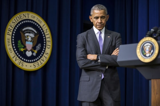 Image: President Barack Obama listens as Vice President Joe Biden spoke at a bill signing in Washington.