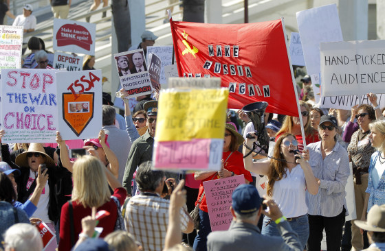 Image: People protest outside of the Junior Seau Beach Community Center as Rep. Darrell Issa holds a town hall meeting inside, March 11, 2017 in Oceanside, California.