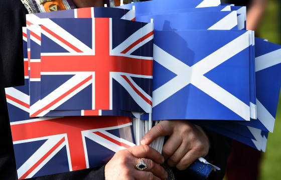 Image: The Union flag of the U.K. and the Saltire flag of Scotland.