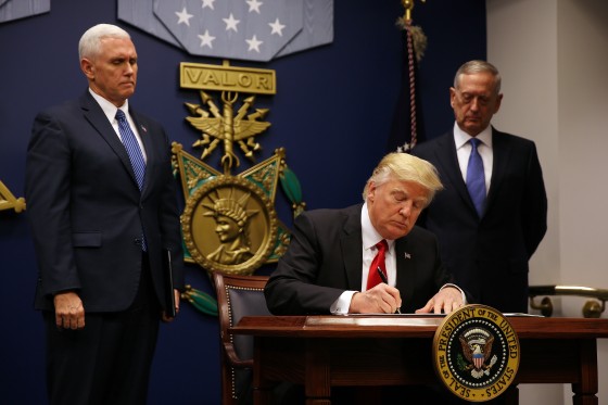 Image: U.S. President Donald Trump signs a travel ban executive order at the Pentagon in Washington