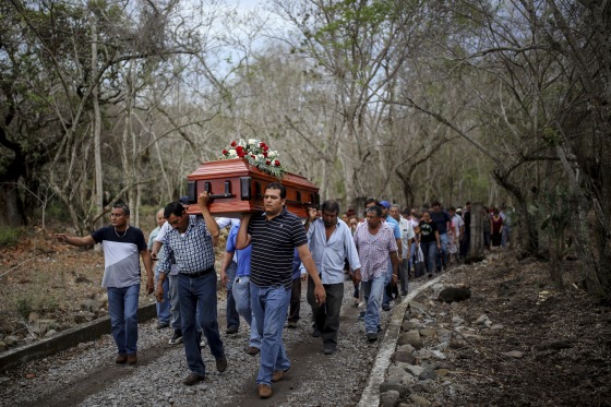 In this March 8, 2017 photo, members of the Solecito search group carry the coffin of Pedro Huesca, a police detective who disappeared in 2013 and was recently found in a mass grave, to the cemetery in Palmas de Abajo, Veracruz, Mexico. Huesca's remains are among more than 250 skulls found over the last several months.