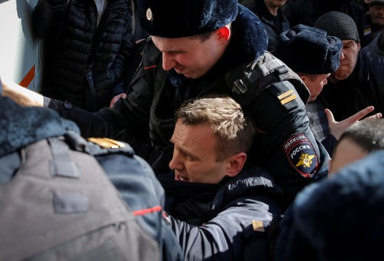 Image: Police officers detain anti-corruption campaigner and opposition figure Alexei Navalny during a rally in Moscow, Russia