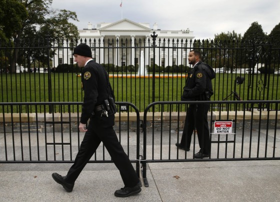 Image: Members of the U.S. Secret Service patrol in front of the North Lawn of the White House in Washington