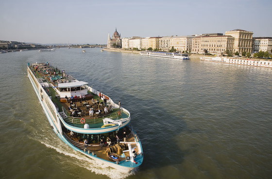 Pleasure cruise boat on the River Danube approaching Szechenyi Chain Bridge