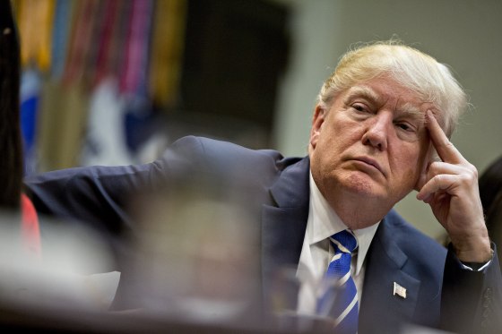 Image: Trump listens while meeting with women small business owners in the Roosevelt Room of the White House