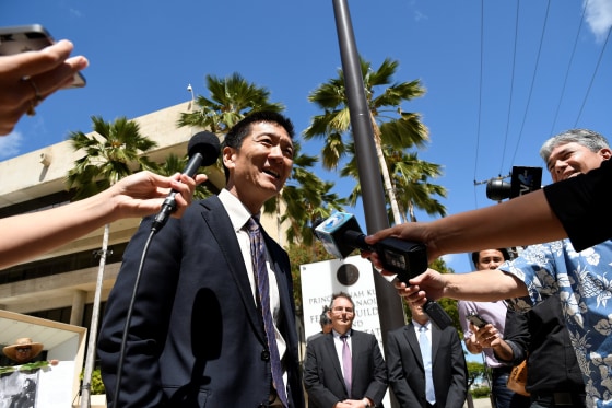 Image: Hawaii Attorney General Douglas Chin talks to the media