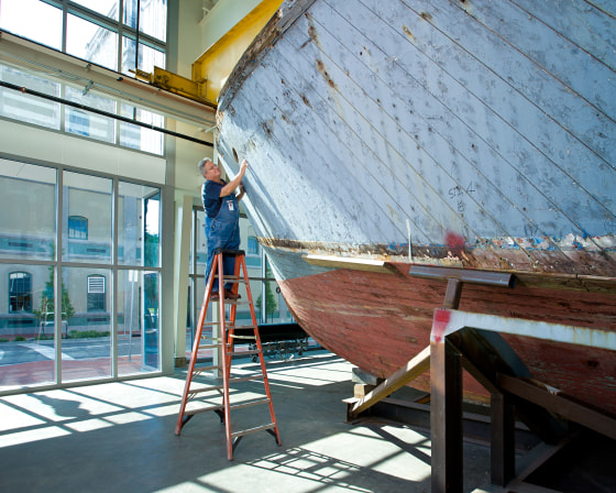 Image: Thomas Czekanski, the Museum's senior curator and restorations manager, with PT-305 shortly after her 2007 return to New Orleans.