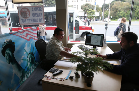 Image: A tax preparer helps a customer in San Francisco