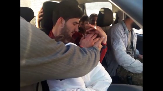 Image: Abdul-Hamid Alyousef, holds his twin babies who were killed during a suspected chemical weapons attack in Syria