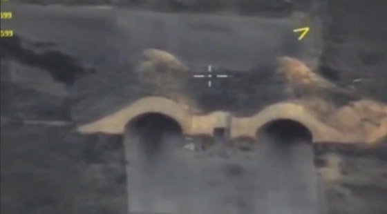 Image: A hangar at the Syrian Shayrat Air Base is seen in this still image taken from undated handout video.