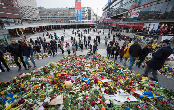 Image: A makeshift memorial commemorates the victims of Friday's terror attack in Stockholm.