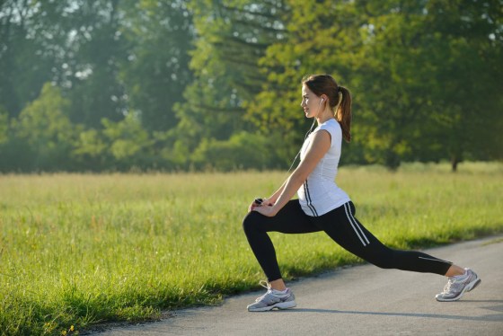 Image: young woman stretching before Fitness and Exercise