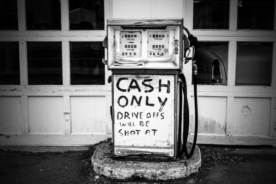 Image: Signs at a gas station in Plymouth.