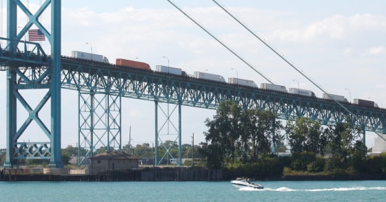Image: Commercial trucks line up on the Ambassador bridge crossing over to Detroit, Michigan from Windsor