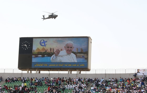 Image: A military helicopter is seen as Pope Francis leads a mass in Cairo