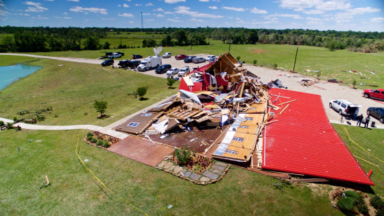 Image: The Rustic Barn, an event hall, which suffered major tornado damage, is seen from an unmanned aerial vehicle in Canton, Texas