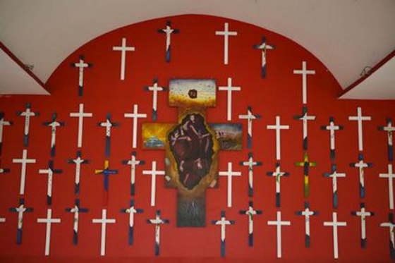 In this Dec. 6, 2016 file photo, crosses representing 72 migrants massacred in 2010 adorn the chapel at La 72, a migrant shelter in Tenosique, Tabasco state, Mexico.