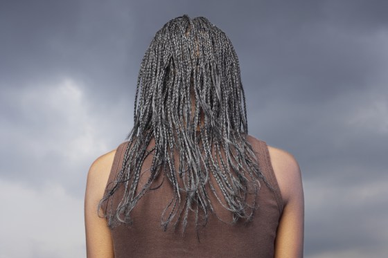 Image: Woman with braided hair, rear view