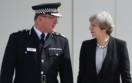 Image: Britain's Prime Minister Theresa May walks with Chief Constable of Greater Manchester Police, Ian Hopkins