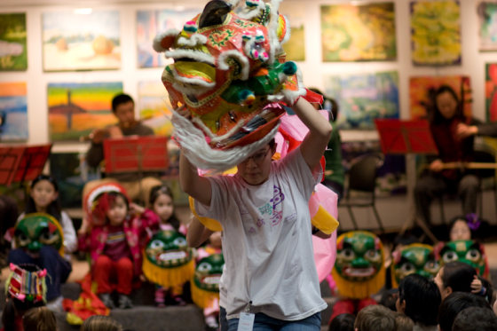 Frances Kai-Hwa Wang's daughter performs a lion dance at the Ann Arbor District Library for a Chinese New Year's presentation