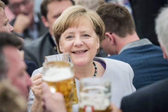 Image: German Chancellor Angela Merkel drinks from a beer during an election campaign event of the German Christian Social Union (CSU) party at the 46th Truderinger Festwoche festival week in Munich, Bavaria, Germany, May 28, 2017.