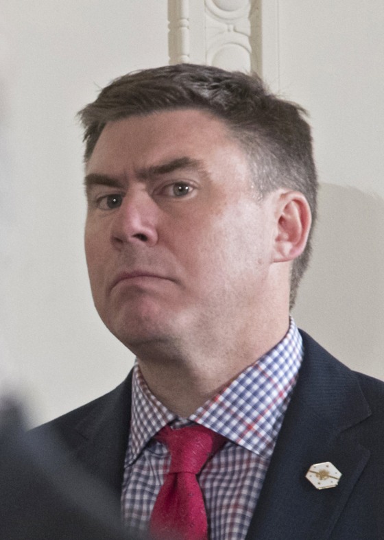 Image: Mike Dubke listens as a reporter asks a question during a press conference at the White House