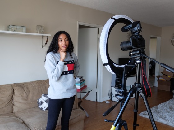 Filipino-American and black actress, model, and content creator Asia Jackson shooting a YouTube video.
