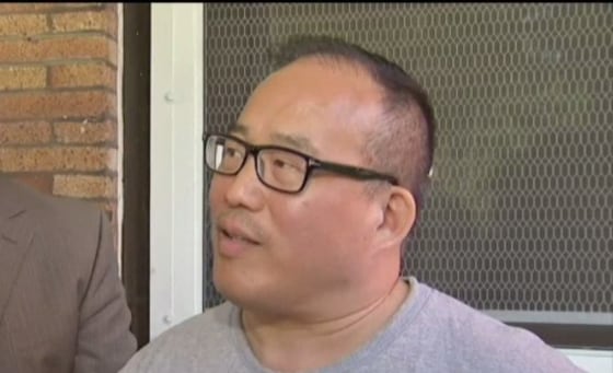 Councilman David Oh at an impromptu press conference on his porch after returning home from the hospital.