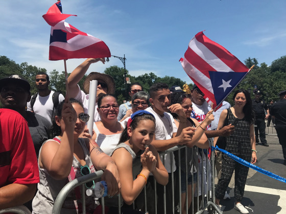A group of spectators line the streets during the 60th Puerto Rican Day Parade.