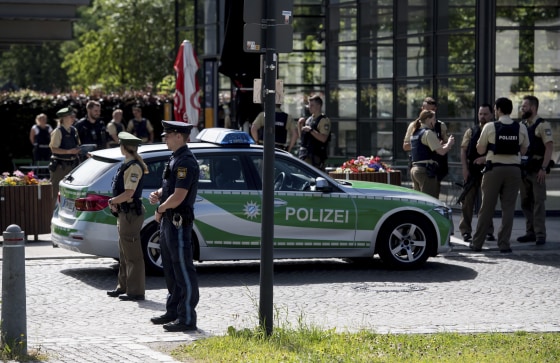Image: Police guard in front of a subway station in Munich, Germany