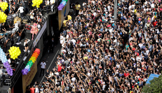 Image: Revellers take part in the Gay Pride parade along Paulista Avenue in Sao Paulo,