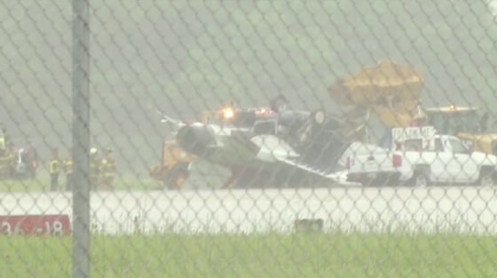 Image: A thunderbird plane is on its top at the Dayton International Airport
