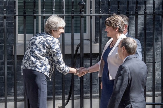 Image: Britain's Prime Minister, Theresa May (L), greets Arlene Foster, the leader of Northern Ireland's Democratic Unionist Party (C), deputy leader of the Democratic Unionist Party, Nigel Dodds (R) and DUP MP Jeffrey Donaldson (at rear).