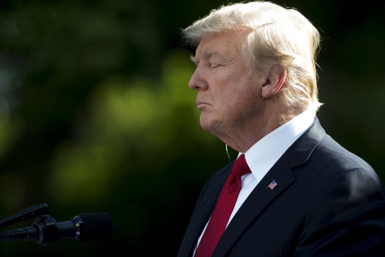 Image: Trump attends a press conference in the Rose Garden