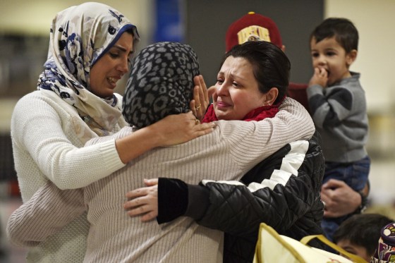 Image: An Iraqi family welcomes their grandmother at Dulles International Airport