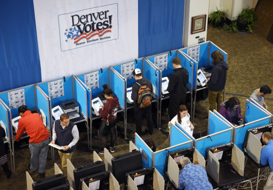 Image: Residents vote at a polling station in Denver