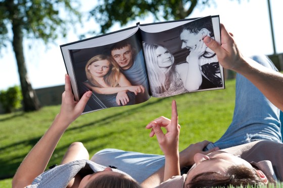 Image: Couple Look at Photo book