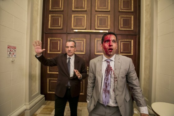 Image: Government supporters break into Venezuelan Parliament and wound deputies