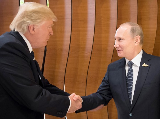 Image: A handout photo made available by the German Government on July 7, 2017 of U.S. President Donald J. Trump shaking hands with Russian President Vladimir Putin.