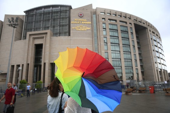 Image: People walk outside the court, in Istanbul, Turkey