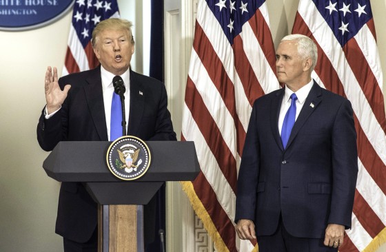 Image: President Donald Trump makes opening remarks next to Vice President Mike Pence