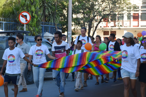 Image: Participants carry a flag during the Pride March in Dili, East Timor