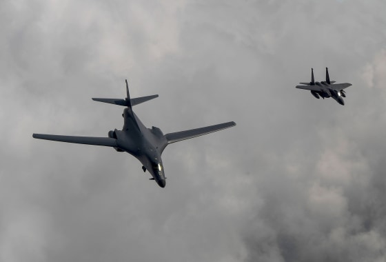 Image: A U.S. Air Force B-1B Lancer bomber (L) fly with South Korean fighter jet F-15K fighter jet over the Korean Peninsula during a South Korea-U.S. joint live fire drill aimed to counter North Korea's missile test on July 30, 2017.